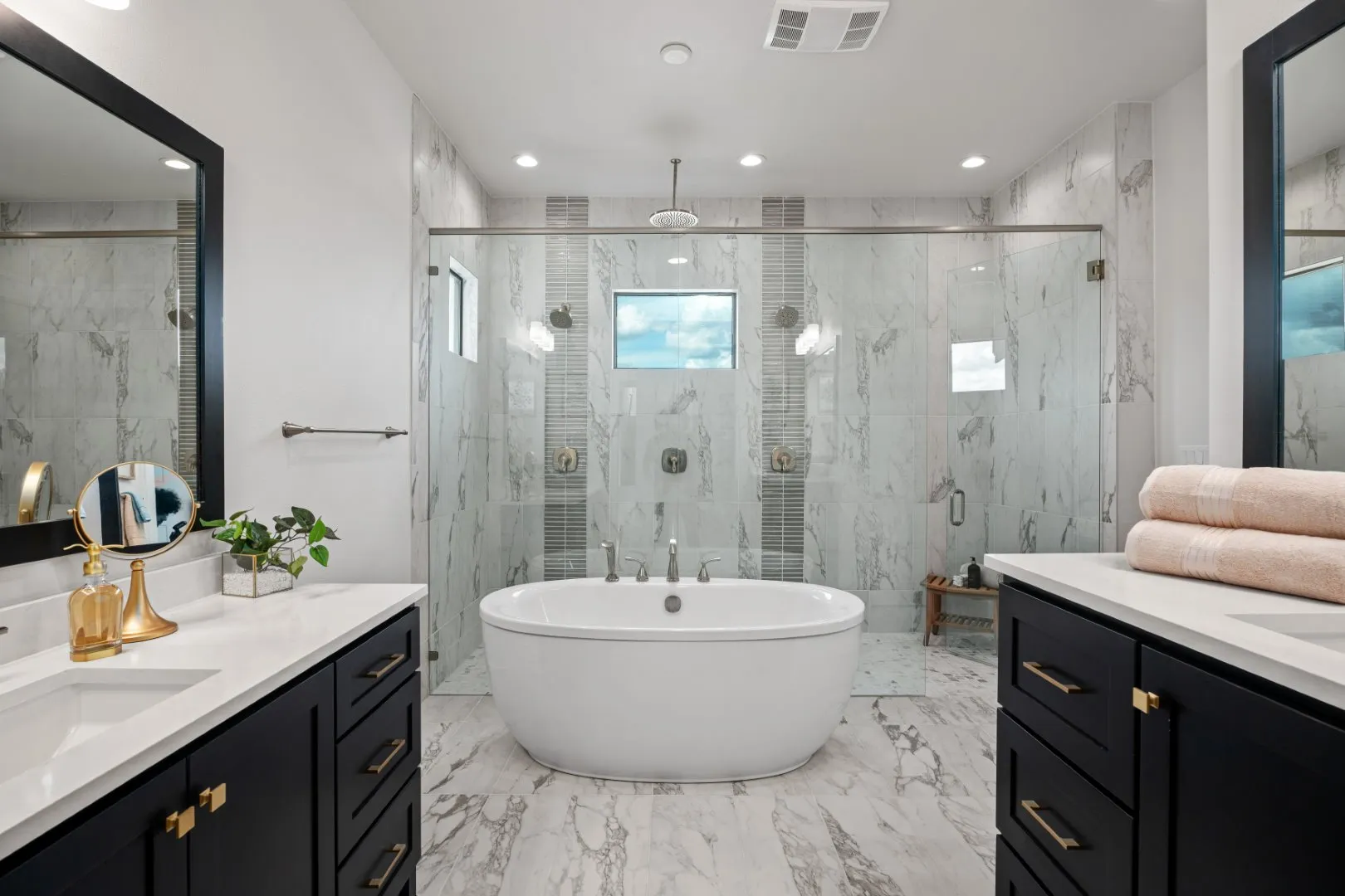 Updated modern bathroom with two sinks by T.A. French.
